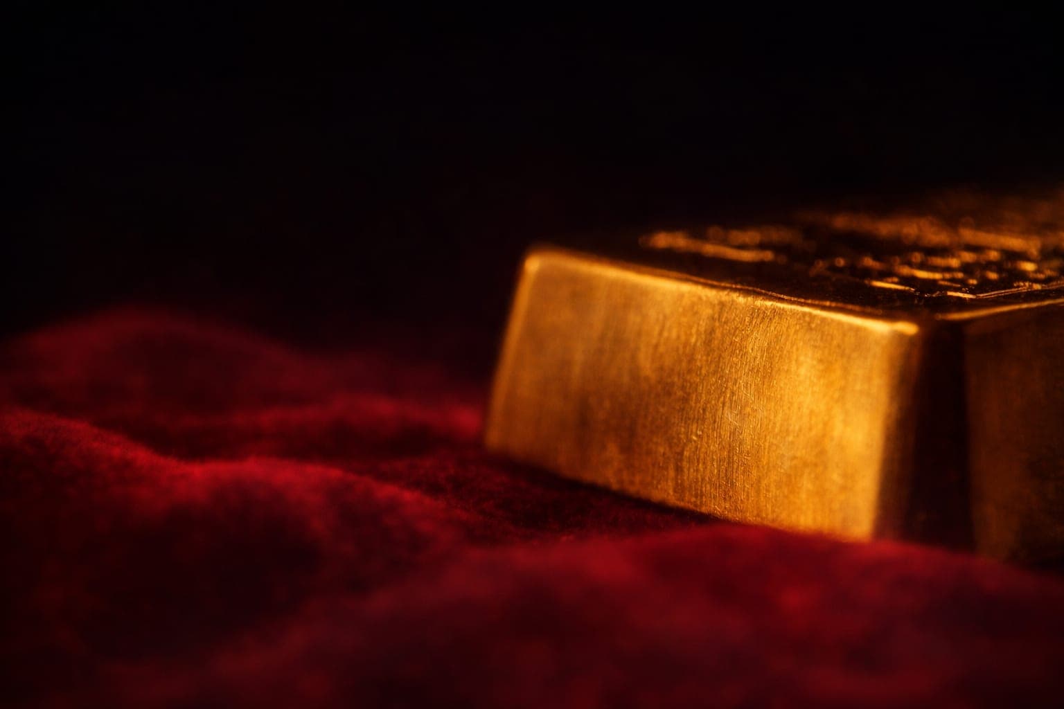 Gold bars and coins representing physical gold investment